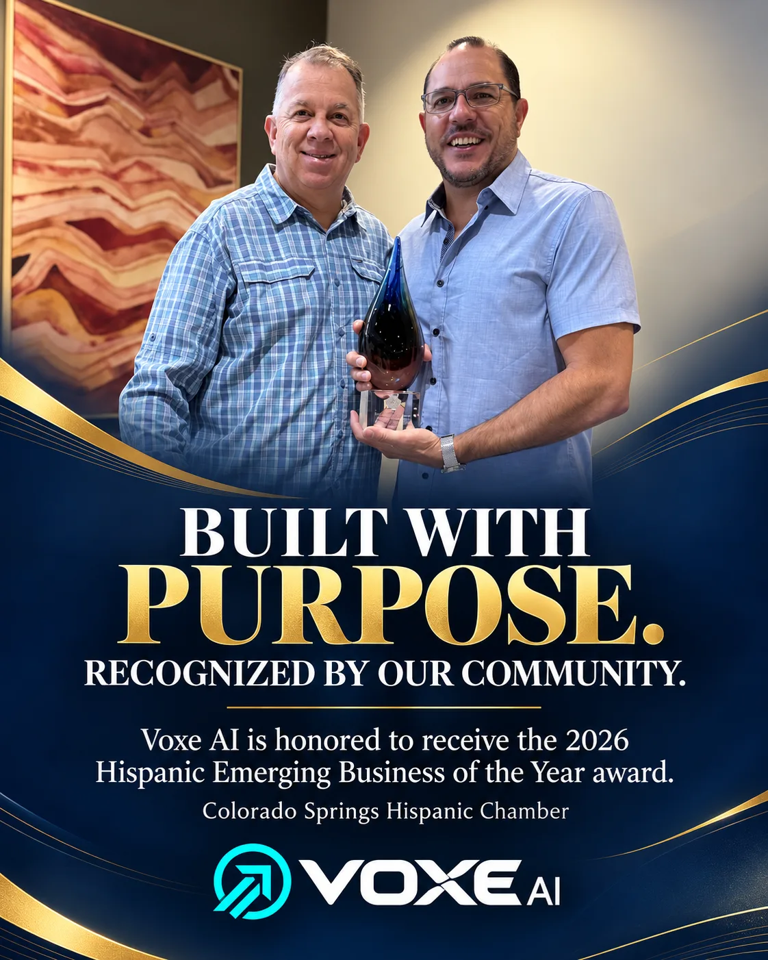 Matt Aponte holding the 2026 Excelencia Business Award for Hispanic Emerging Business of the Year, alongside Joe Aldaz, President and CEO of the Colorado Springs Hispanic Chamber of Commerce
